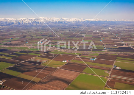 Fields spreading across the Tokachi Plain in spring - before landing at Tokachi Obihiro Airport Fields spreading across the Tokachi Plain in spring - before landing at Tokachi Obihiro Airport 113752434