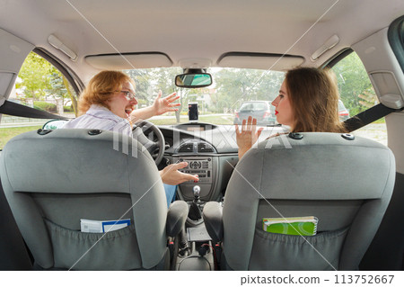 Displeased woman in car with boyfriend Displeased woman in car with boyfriend 113752667