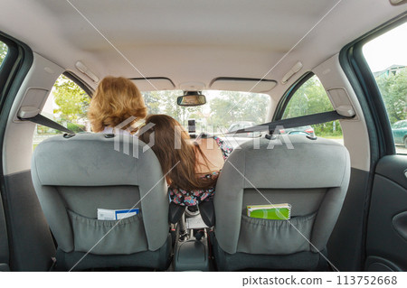 Man and woman embracing in car Man and woman embracing in car 113752668