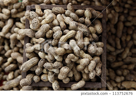 peanuts in shells close up on market 113752676