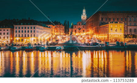 Stockholm, Sweden. Scenic Famous View Of Embankment In Old Town Of Stockholm In Night Lights. Great Church Or Church Of St. Nicholas And Royal Palace. Famous Popular Destination Scenic Place In Light 113753289