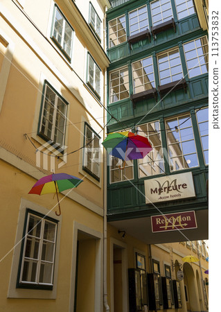 A street in Vienna with suspended umbrellas A street in Vienna with suspended umbrellas 113753832