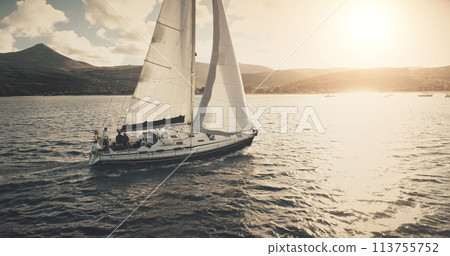 Brodick Harbour, Arran Island, Scotland. Luxury yacht travel at sun shine sea bay aerial. Sailing on motor boat in wind at ocean harbor. Amazing nature seascape at summer. Marine vacation 113755752