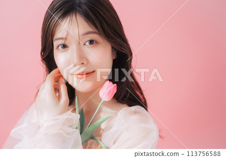 Beauty image of young woman and flowers 113756588