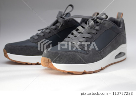 Gray sports sneakers on white background Gray sports sneakers on white background 113757288