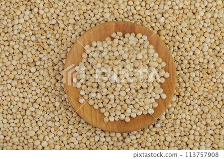background of sorghum seeds with wooden bowl. Top view. Flat lay. 113757908