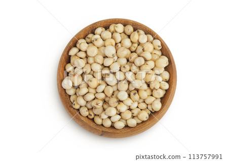 Sorghum seeds in wooden bowl isolated on white background. Top view. Flat lay. Sorghum seeds in wooden bowl isolated on white background. Top view. Flat lay. 113757991