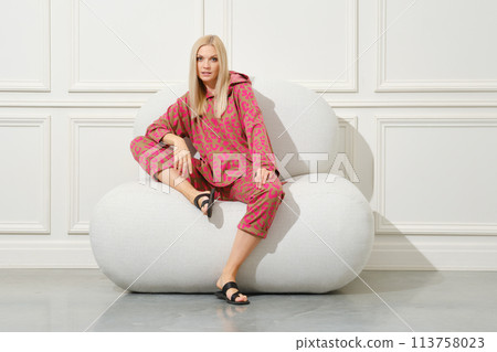 Blonde woman in a cozy home suit Blonde woman in a cozy home suit 113758023