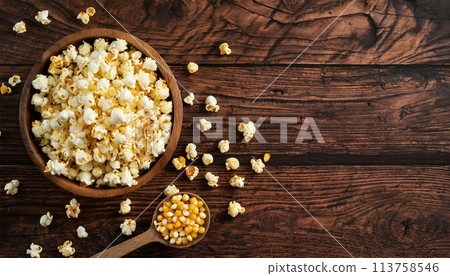 Wooden Cup Full of Popcorn on a Wooden Table with Copy Space - Generative Ai 113758546