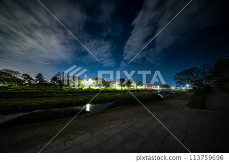 Riverside at night and shining street lights 113759696