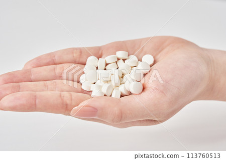 Many pills in the palm of a hand Many pills in the palm of a hand 113760513