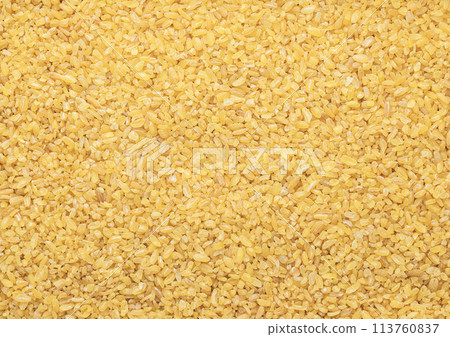 Yellow raw organic healthy bulgur grain seeds textured background. Yellow raw organic healthy bulgur grain seeds textured background. 113760837