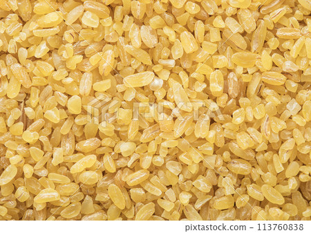 Yellow raw organic healthy bulgur grain seeds textured background. Yellow raw organic healthy bulgur grain seeds textured background. 113760838