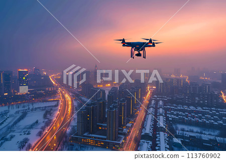flying drone above the city at snowy winter night 113760902