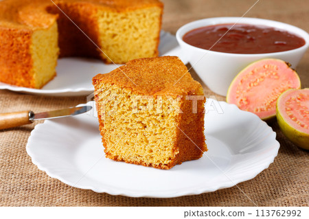 corn cake on white plate on rustic wooden table. Typical Brazilian party food. 113762992