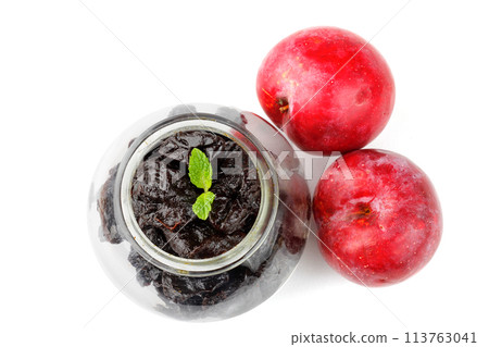 Dried plum in a glass bowl isolated on a white background top view 113763041