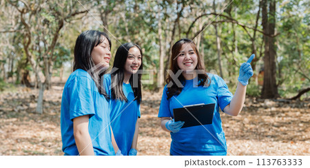 Volunteer team in nature for community service, teamwork and planning with leadership 113763333