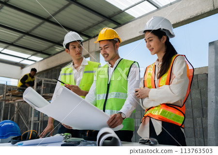 team engineer, foreman, architect meeting for colleagues discussing and checks construction blueprints at onsite 113763503