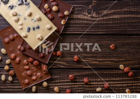Chocolate bar pieces. Background with chocolate. Sweet food photo concept. 113765288