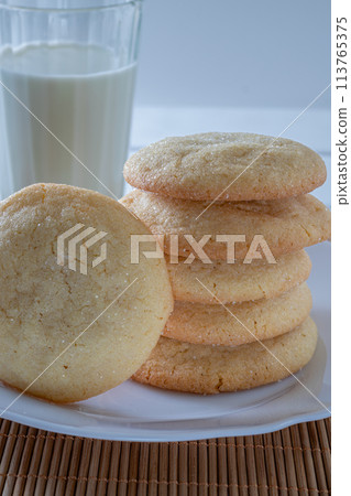 Delicious sugar cookies on wooden table, closeup Delicious sugar cookies on wooden table, closeup 113765375