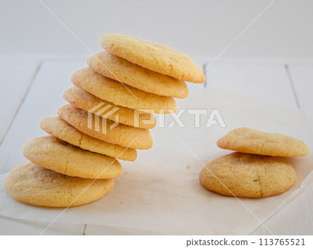 Delicious sugar cookies on wooden table, closeup Delicious sugar cookies on wooden table, closeup 113765521