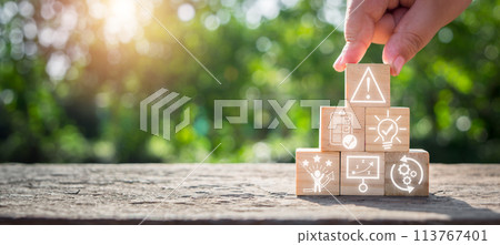 Crisis management concept, Hand holding wooden block on desk with identify, assessment, understand, cope, strategy and recovery icon on virtual screen. 113767401