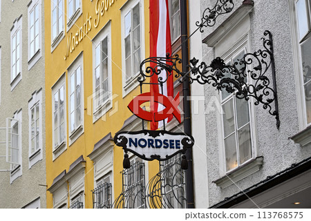 Ironwork sign at Getreidegasse in Salzburg 113768575