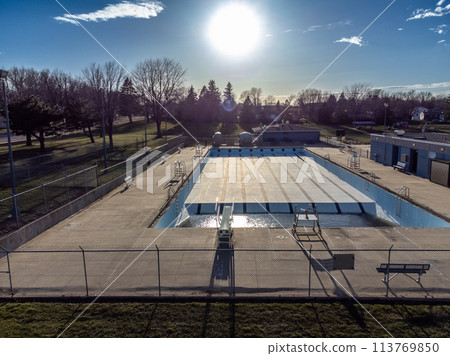 Drone view of an empty and drained winterized swimming pool  113769850