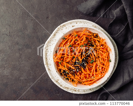 Raw carrot noodles or spaghetti, top view Raw carrot noodles or spaghetti, top view 113770046