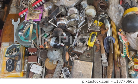 A flea market of old rusty things and tools. A flea market of old rusty things and tools. 113770602