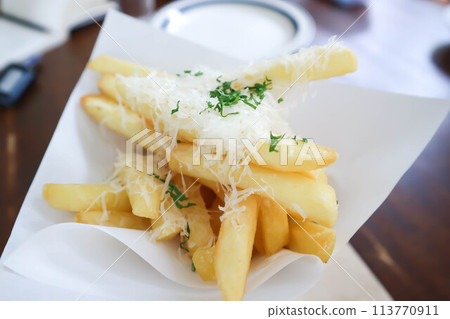 French fries or fried potato ,cheese fries or french fries with cheese topping French fries or fried potato ,cheese fries or french fries with cheese topping 113770911