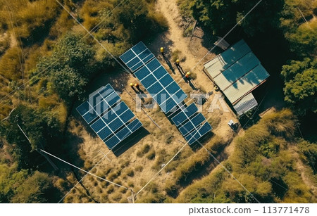 Workers building solar panel system on roof of house 113771478