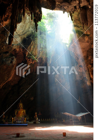 Ray of sunlight breaking into Khao Luang Cave 113772019