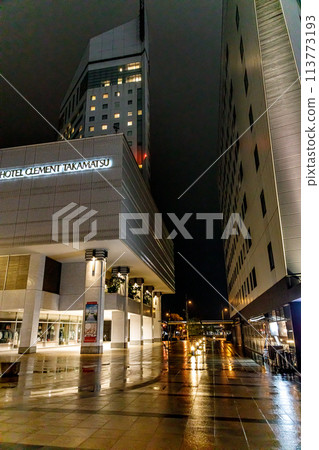 A rain-soaked night scene in front of Takamatsu Station 113773193