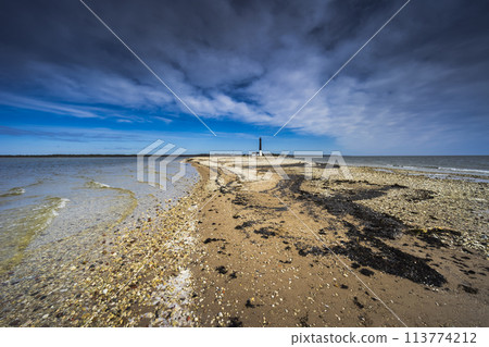 Pebble beach at the Sorve Lighthouse in Saaremma, Estonia 113774212