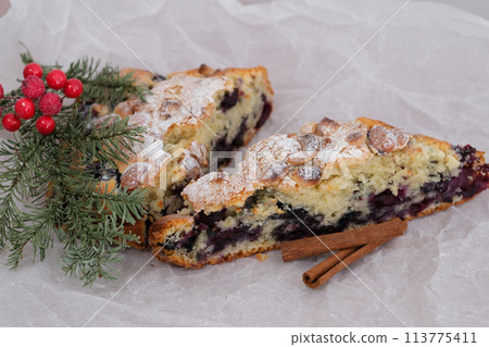 Sprinkling the fresh apple pie with powdered sugar isolated on black. High quality 4k footage 113775411