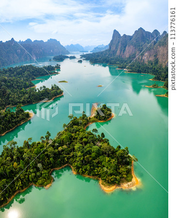Aerial view of Khao Sok national park, in Cheow lan lake, Surat Thani, Thailand Aerial view of Khao Sok national park, in Cheow lan lake, Surat Thani, Thailand 113776161