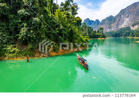 Aerial view of Khao Sok national park, in Cheow lan lake, Surat Thani, Thailand Aerial view of Khao Sok national park, in Cheow lan lake, Surat Thani, Thailand 113776164