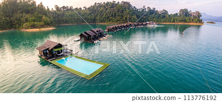Floating bungalow on the Cheow lan Lake in Khao Sok National Park in Surat Thani, Thailand Floating bungalow on the Cheow lan Lake in Khao Sok National Park in Surat Thani, Thailand 113776192