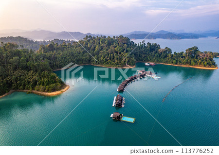 Floating bungalow on the Cheow lan Lake in Khao Sok National Park in Surat Thani, Thailand Floating bungalow on the Cheow lan Lake in Khao Sok National Park in Surat Thani, Thailand 113776252