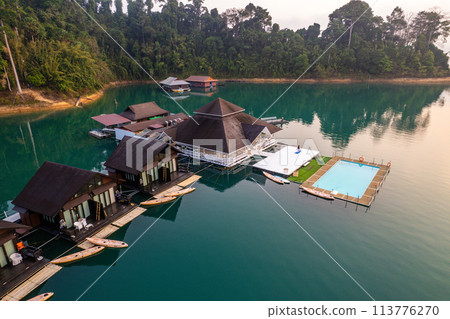 Floating bungalow on the Cheow lan Lake in Khao Sok National Park in Surat Thani, Thailand Floating bungalow on the Cheow lan Lake in Khao Sok National Park in Surat Thani, Thailand 113776270