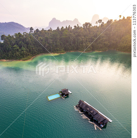 Floating bungalow on the Cheow lan Lake in Khao Sok National Park in Surat Thani, Thailand Floating bungalow on the Cheow lan Lake in Khao Sok National Park in Surat Thani, Thailand 113776303