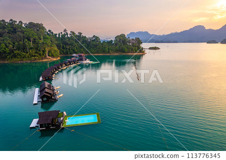 Floating bungalow on the Cheow lan Lake in Khao Sok National Park in Surat Thani, Thailand Floating bungalow on the Cheow lan Lake in Khao Sok National Park in Surat Thani, Thailand 113776345