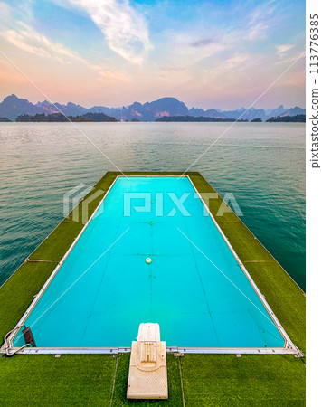 Floating bungalow on the Cheow lan Lake in Khao Sok National Park in Surat Thani, Thailand Floating bungalow on the Cheow lan Lake in Khao Sok National Park in Surat Thani, Thailand 113776385