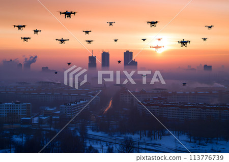 group of drones over city at winter sunset or sunrise 113776739
