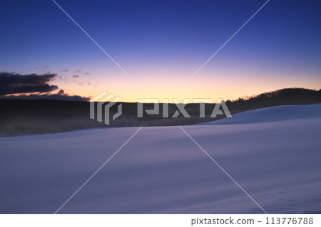 Winter sky seen from a hill at dawn Winter sky seen from a hill at dawn 113776788