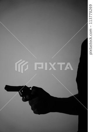 Man spy detective holding pistol gun Man spy detective holding pistol gun 113778269