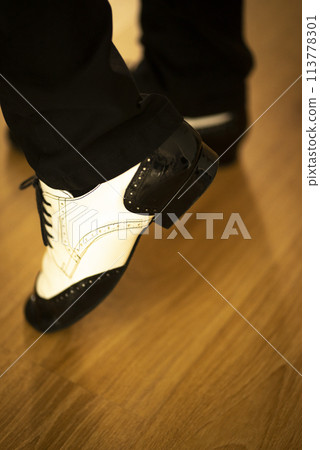 Man dancing jazz shoes 113778301