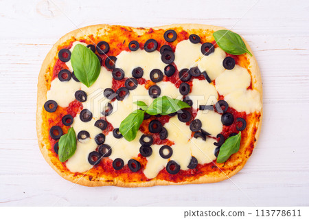 Traditional italian pizza with vegetables olives and  basil 113778611