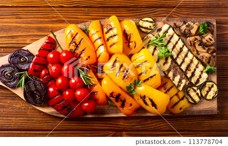 Colorful grilled vegetables on a pan barbecue Colorful grilled vegetables on a pan barbecue 113778704